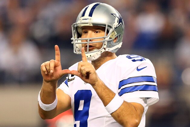 ARLINGTON, TX - DECEMBER 21:  Tony Romo #9 of the Dallas Cowboys directs the offense against the Indianapolis Colts in the first half at AT&T Stadium on December 21, 2014 in Arlington, Texas.  (Photo by Ronald Martinez/Getty Images)