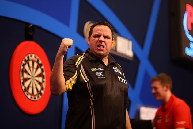 LONDON, ENGLAND - DECEMBER 23: Adrian Lewis of England celebrates winning his first round match against David Pallett of England during the William Hill PDC World Darts Championships on Day Six at Alexandra Palace on December 23, 2014 in London, England. (Photo by Charlie Crowhurst/Getty Images)