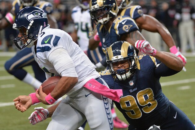 ST. LOUIS, MO - OCTOBER 19:  Quarterback Russell Wilson #3 of the Seattle Seahawks runs with the ball against the St. Louis Rams in the fourth quarter at the Edward Jones Dome on October 19,  2014 in St. Louis, Missouri. The Rams defeated the Seahawks 28-26.  (Photo by Michael B. Thomas/Getty Images)