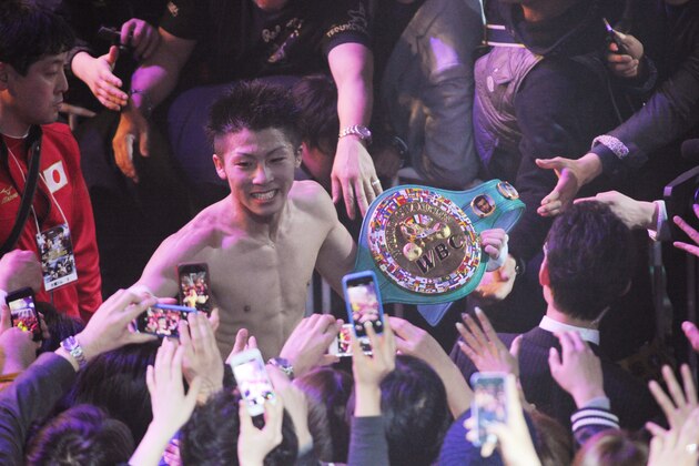 TOKYO, JAPAN - APRIL 06:  New champion,Naoya Inoue celebrates the victory with fans after the WBC light flyweight title bout between Adrian Hernandez of Mexico v Naoya Inoue of Japan at Ota City General Gymnasium on April 6, 2014 in Tokyo, Japan.  (Photo by Masashi Hara/Getty Images)