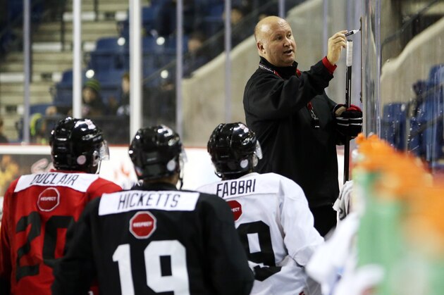 ST CATHARINES, ON - DECEMBER 15:  Head Coach Benoit Groulx draws on a white board during the Canada National Junior Team practice at the Meridian Centre on December 15, 2014 in St Catharines, Ontario, Canada.  (Photo by Vaughn Ridley/Getty Images)