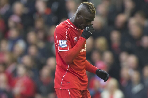 Liverpool's Mario Balotelli makes his way from the pitch after being substituted during his team's English Premier League soccer match between Liverpool and Chelsea at Anfield Stadium, Liverpool, England, Saturday Nov. 8, 2014. (AP Photo/Jon Super)