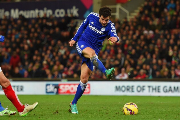 STOKE ON TRENT, ENGLAND - DECEMBER 22:  Cesc Fabregas of Chelsea scores their second goal during the Barclays Premier League match between Stoke City and Chelsea at Britannia Stadium on December 22, 2014 in Stoke on Trent, England.  (Photo by Michael Regan/Getty Images)