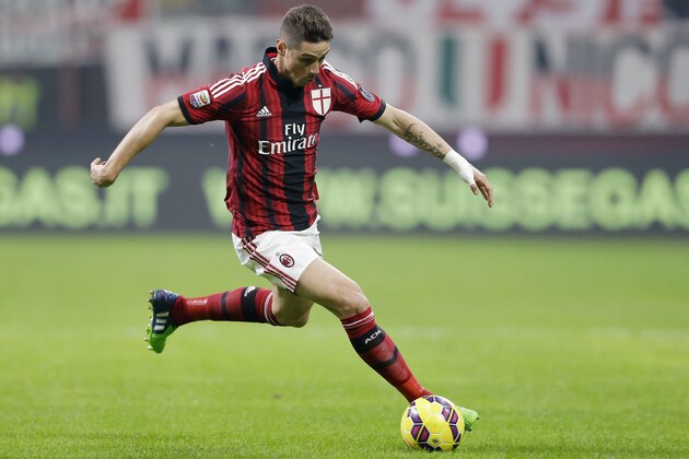 AC Milan's Fernando Torres controls the ball during the Serie A soccer match between AC Milan and Palermo at the San Siro stadium in Milan, Italy, Sunday, Nov. 2, 2014. (AP Photo/Antonio Calanni)