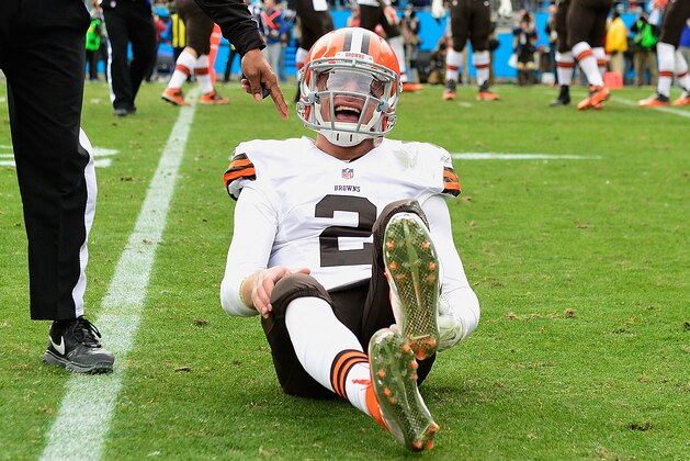 CHARLOTTE, NC - DECEMBER 21:  Johnny Manziel #2 of the Cleveland Browns reacts after being hit by Luke Kuechly #59 of the Carolina Panthers during their game at Bank of America Stadium on December 21, 2014 in Charlotte, North Carolina.  (Photo by Grant Halverson/Getty Images)