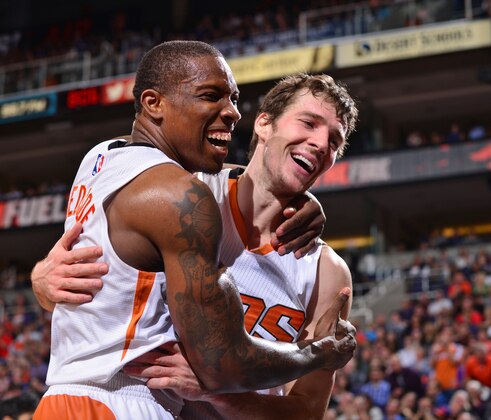 PHOENIX, AZ - DECEMBER 23:  Eric Bledsoe #2 and Goran Dragic #1 of the Phoenix Suns celebrate during the game against the Dallas Mavericks on December 23, 2014 at U.S. Airways Center in Phoenix, Arizona. NOTE TO USER: User expressly acknowledges and agrees that, by downloading and or using this photograph, user is consenting to the terms and conditions of the Getty Images License Agreement. Mandatory Copyright Notice: Copyright 2014 NBAE (Photo by Barry Gossage/NBAE via Getty Images)