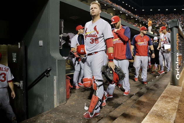 St. Louis Cardinals catcher A.J. Pierzynski, center, heads to the clubhouse after an interleague baseball game against the Baltimore Orioles, Friday, Aug. 8, 2014, in Baltimore. Baltimore won 12-2. (AP Photo/Patrick Semansky)