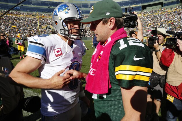 Detroit Lions' Matthew Stafford talks to Green Bay Packers' Aaron Rodgers after an NFL football game Sunday, Oct. 6, 2013, in Green Bay, Wis. The Packers won 22-9. (AP Photo/Mike Roemer)