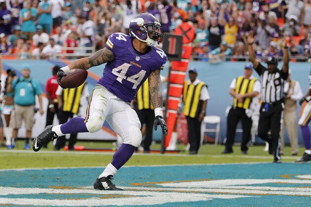 MIAMI GARDENS, FL - DECEMBER 21:  Running back Matt Asiata #44 of the Minnesota Vikings runs in the end zone as he scored a fourth quarter touchdown during a game against the Miami Dolphins at Sun Life Stadium on December 21, 2014 in Miami Gardens, Florida.  (Photo by Rob Foldy/Getty Images)