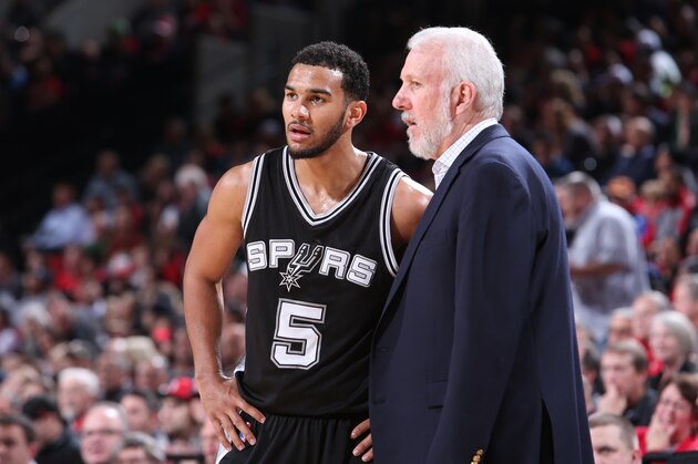 PORTLAND, OR - DECEMBER 15:  Cory Joseph #5 of the San Antonio Spurs talks with Head Coach Gregg Popovich during the game against the Portland Trail Blazers on December 15, 2014 at the Moda Center in Portland, Oregon. NOTE TO USER: User expressly acknowledges and agrees that, by downloading and or using this Photograph, user is consenting to the terms and conditions of the Getty Images License Agreement. Mandatory Copyright Notice: Copyright 2014 NBAE (Photo by Sam Forencich/NBAE via Getty Images)
