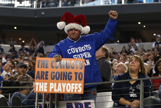 Dec 21, 2014; Arlington, TX, USA; Dallas Cowboys fan holds a sign that the Cowboys are going to the playoffs against the Indianapolis Colts at AT&T Stadium. Mandatory Credit: Matthew Emmons-USA TODAY Sports