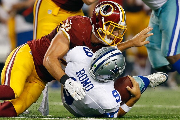ARLINGTON, TX - OCTOBER 27:  Ryan Kerrigan #91 of the Washington Redskins sacks Tony Romo #9 of the Dallas Cowboys during the first half at AT&T Stadium on October 27, 2014 in Arlington, Texas.  (Photo by Tom Pennington/Getty Images)