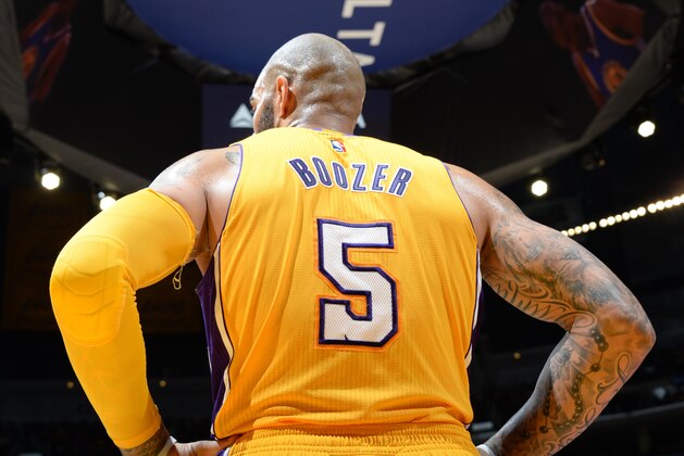 LOS ANGELES, CA - DECEMBER 23:  Carlos Boozer #5 of the Los Angeles Lakers during the game against the Golden State Warriors on December 23, 2014 at Staples Center in Los Angeles, California. NOTE TO USER: User expressly acknowledges and agrees that, by downloading and or using this Photograph, user is consenting to the terms and conditions of the Getty Images License Agreement. Mandatory Copyright Notice: Copyright 2014 NBAE (Photo by Andrew D. Bernstein/NBAE via Getty Images)