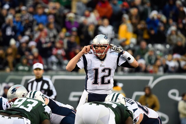 EAST RUTHERFORD, NJ - DECEMBER 21: Quarterback Tom Brady #12 of the New England Patriots calls a play against the New York Jets during a game at MetLife Stadium on December 21, 2014 in East Rutherford, New Jersey.  (Photo by Alex Goodlett/Getty Images)