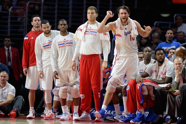 Dec 3, 2014; Los Angeles, CA, USA; Los Angeles Clippers forward Spencer Hawes (10) reacts from the bench as Los Angeles Clippers forward Blake Griffin (32), Los Angeles Clippers guard Chris Paul (3), Los Angeles Clippers guard Jordan Farmar (1) and Los Angeles Clippers guard J.J. Redick (4) look on against the Orlando Magic during the second half at Staples Center. Clippers defeated Magic 114-86. Mandatory Credit: Richard Mackson-USA TODAY Sports