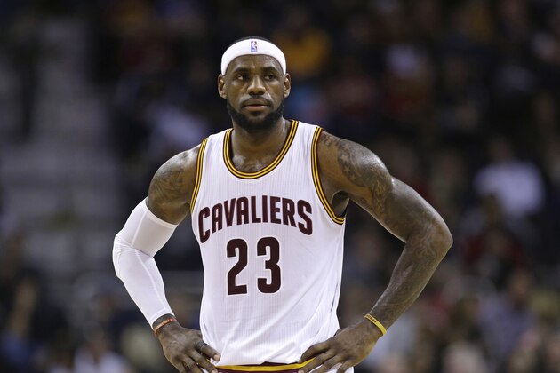 Cleveland Cavaliers' LeBron James (23) waits for action to resume during an NBA basketball game against the Brooklyn Nets Friday, Dec. 19, 2014, in Cleveland. (AP Photo/Tony Dejak)