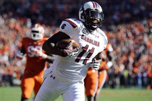 South Carolina wide receiver Pharoh Cooper (11) runs for a touchdown against Clemson during the first half of an NCAA college football game, Saturday, Nov. 29, 2014, in Clemson, S.C. (AP Photo/Rainier Ehrhardt)