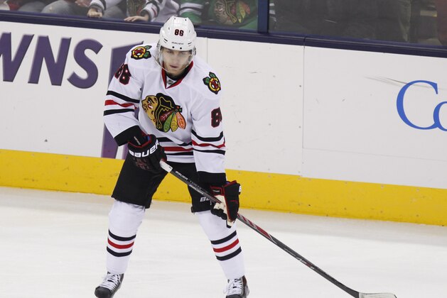 Chicago Blackhawks' Patrick Kane carries the puck against the Columbus Blue Jackets during an NHL hockey game in Columbus, Ohio, Saturday, Dec. 20, 2014. (AP Photo/Paul Vernon)