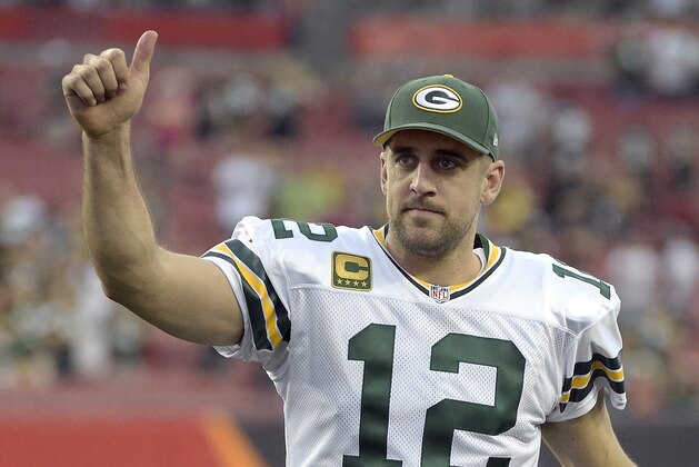 Green Bay Packers quarterback Aaron Rodgers (12) gives the thumbs up to fans as he leaves the field following the team's 20-3 win over the Tampa Bay Buccaneers during an NFL football game Sunday, Dec. 21, 2014, in Tampa, Fla. (AP Photo/Phelan M. Ebenhack)
