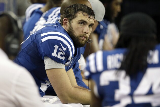 Indianapolis Colts quarterback Andrew Luck (12) sits on the bench during the fourth quarter of an NFL football game against the Dallas Cowboys, Sunday, Dec. 21, 2014, in Arlington, Texas. (AP Photo/Tim Sharp)