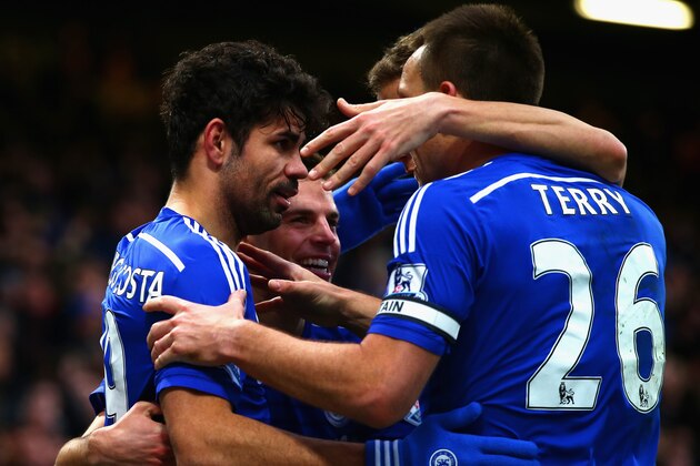 LONDON, ENGLAND - DECEMBER 26:  Diego Costa of Chelsea celebrates scoring their second goal with team mates during the Barclays Premier League match between Chelsea and West Ham United at Stamford Bridge on December 26, 2014 in London, England.  (Photo by Clive Rose/Getty Images)