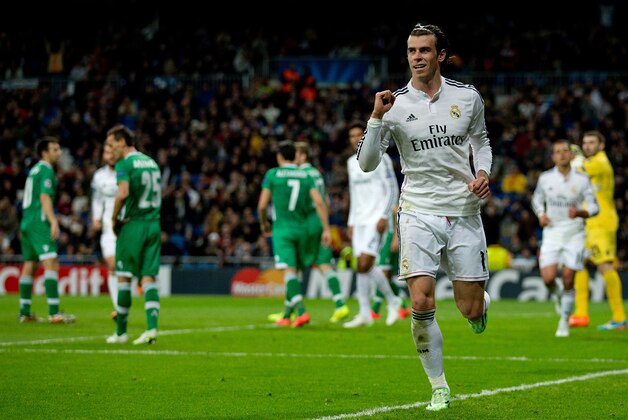 MADRID, SPAIN - DECEMBER 09:  Gareth Bale of Real Madrid CF celebrates scoring their second goal during the UEFA Champions League Group B match between Real Madrid CF and PFC Ludogorets Razgrad at Estadio Santiago Bernabeu on December 9, 2014 in Madrid, Spain.  (Photo by Gonzalo Arroyo Moreno/Getty Images)