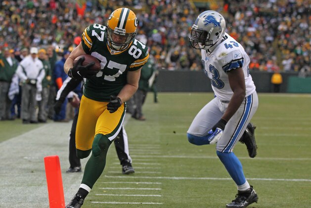 GREEN BAY, WI - JANUARY 01: Jordy Nelson #87 of the Green Bay Packers crosses the goalline in front of Chris Harris #43 of the Detroit Lions at Lambeau Field on January 1, 2012 in Green Bay, Wisconsin. (Photo by Jonathan Daniel/Getty Images)
