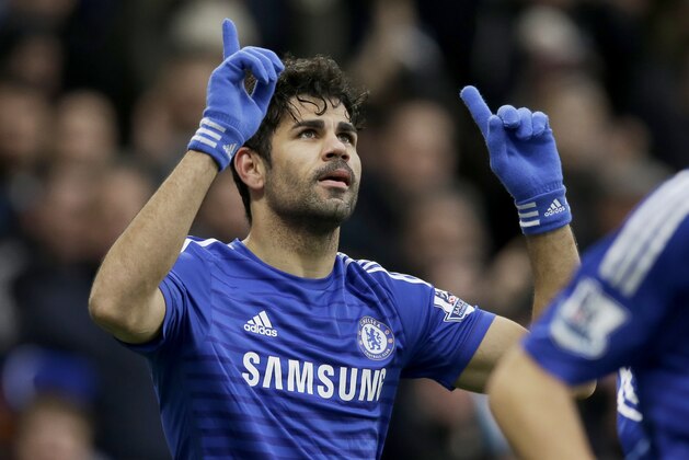 Chelsea's Diego Costa celebrates scoring his side's second goal during the English Premier League soccer match between Chelsea and West Ham at Stamford Bridge stadium in London, Friday, Dec. 26, 2014.  (AP Photo/Matt Dunham)