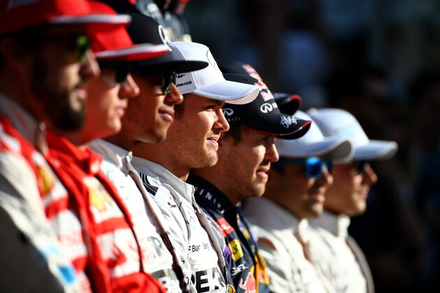 ABU DHABI, UNITED ARAB EMIRATES - NOVEMBER 23:  (L-R front row) Fernando Alonso of Spain and Ferrari, Kimi Raikkonen of Finland and Ferrari, Lewis Hamilton of Great Britain and Mercedes GP, Nico Rosberg of Germany and Mercedes GP, Sebastian Vettel of Germany and Infiniti Red Bull Racing, Felipe Massa of Brazil and Williams and Valtteri Bottas of Finland and Williams pose for a drivers' photo before the Abu Dhabi Formula One Grand Prix at Yas Marina Circuit on November 23, 2014 in Abu Dhabi, United Arab Emirates.  (Photo by Mark Thompson/Getty Images)