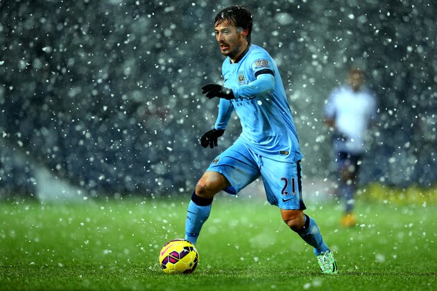 WEST BROMWICH, ENGLAND - DECEMBER 26:  David Silva of Manchester City runs with the ball during the Barclays Premier League match between West Bromwich Albion and Manchester City at The Hawthorns on December 26, 2014 in West Bromwich, England.  (Photo by Richard Heathcote/Getty Images)