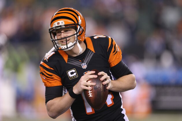 CINCINNATI, OH - DECEMBER 22:  Andy Dalton #14 of the Cincinnati Bengals throws a pass before the game against the Denver Broncos at Paul Brown Stadium on December 22, 2014 in Cincinnati, Ohio.  (Photo by Andy Lyons/Getty Images)