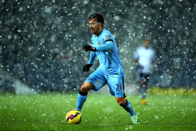 WEST BROMWICH, ENGLAND - DECEMBER 26:  David Silva of Manchester City runs with the ball during the Barclays Premier League match between West Bromwich Albion and Manchester City at The Hawthorns on December 26, 2014 in West Bromwich, England.  (Photo by Richard Heathcote/Getty Images)