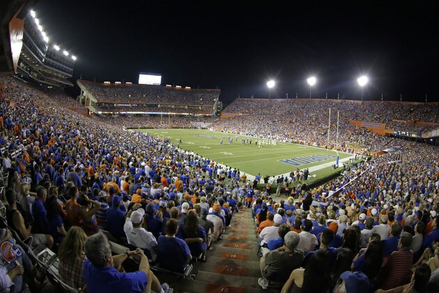 Fans watch an NCAA college football game at Ben Hill Griffin Stadium at Florida Field between Florida and LSU in Gainesville, Fla., Saturday, Oct. 11, 2014. (AP Photo/John Raoux)