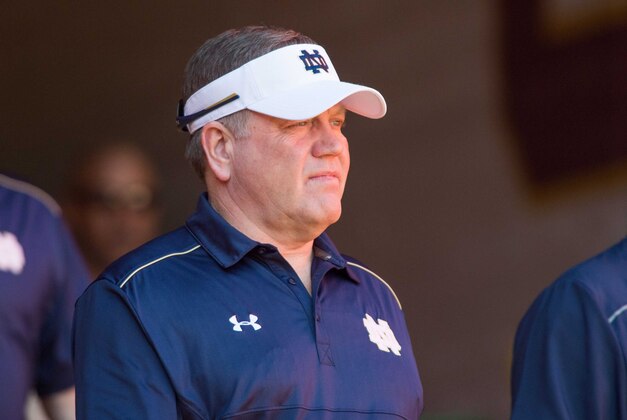 Nov 29, 2014; Los Angeles, CA, USA; Notre Dame Fighting Irish head coach Brian Kelly walks onto the field for warmups before the game against the USC Trojans at the Los Angeles Memorial Coliseum. Mandatory Credit: Matt Cashore-USA TODAY Sports