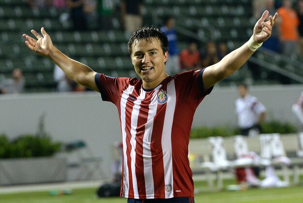 Jul 5, 2014; Carson, CA, USA;  Chivas USA forward Erick Torres (9) raises his arms to the crowd celebrating his goal that won the game in extra time against the Montreal Impact at StubHub Center. Mandatory Credit: Jayne Kamin-Oncea-USA TODAY Sports