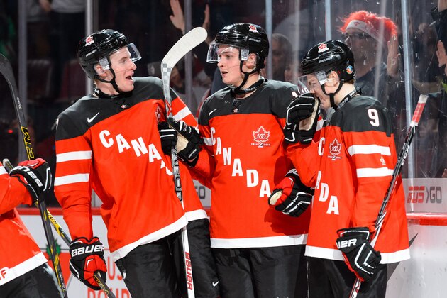 MONTREAL, QC - DECEMBER 26:  Jake Virtanen #18 of Team Canada celebrates his goal with teammates during the 2015 IIHF World Junior Hockey Championship game against Team Slovakia at the Bell Centre on December 26, 2014 in Montreal, Quebec, Canada.  Team Canada defeated Team Slovakia 8-0.  (Photo by Minas Panagiotakis/Getty Images)