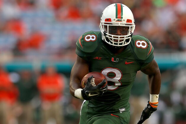 MIAMI, FL - SEPTEMBER 13:  Duke Johnson #8 of the Miami Hurricanes rushes for a touchdown during a game against the Arkansas State Red Wolves at Sunlife Stadium on September 13, 2014 in Miami, Florida.  (Photo by Mike Ehrmann/Getty Images)