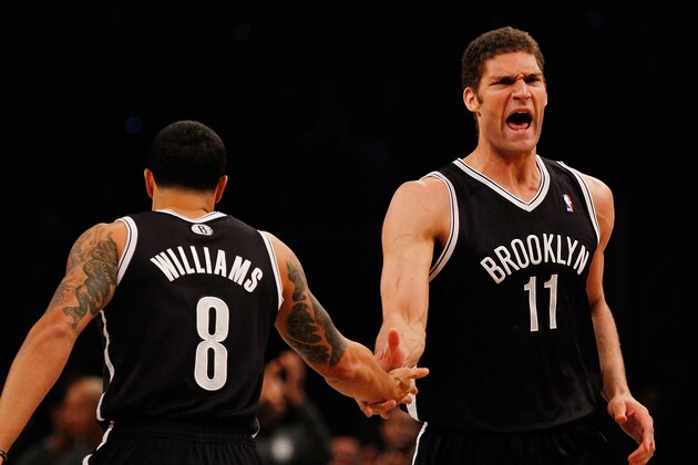 NEW YORK, NY - APRIL 20:  Brook Lopez #11 of the Brooklyn Nets celebrates after hitting a basket with Deron Williams #8 against the Chicago Bulls during Game One of the Eastern Conference Quarterfinals of the 2013 NBA Playoffs at Barclays Center on April 20, 2013 in New York City. NOTE TO USER: User expressly acknowledges and agrees that, by downloading and or using this photograph, User is consenting to the terms and conditions of the Getty Images License Agreement.  (Photo by Mike Stobe/Getty Images)