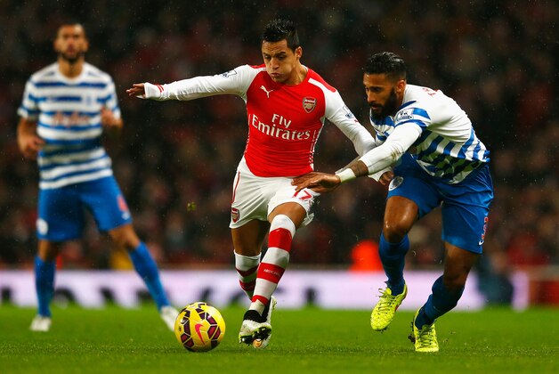 LONDON, ENGLAND - DECEMBER 26: Alexis Sanchez of Arsenal is closed down by Armand Traore of QPR during the Barclays Premier League match between Arsenal and Queens Park Rangers at Emirates Stadium on December 26, 2014 in London, England.  (Photo by Julian Finney/Getty Images)