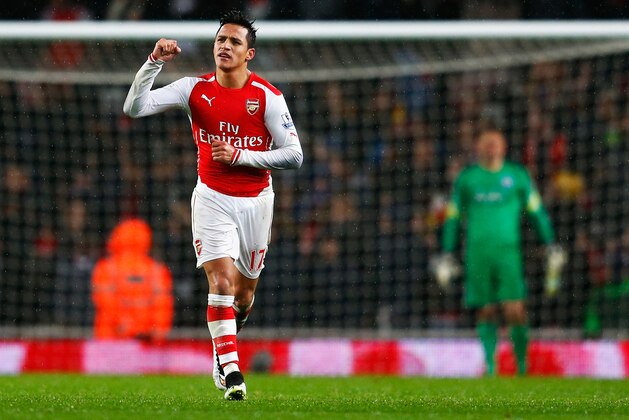 LONDON, ENGLAND - DECEMBER 26:  Alexis Sanchez of Arsenal celebrates his goal during the Barclays Premier League match between Arsenal and Queens Park Rangers at Emirates Stadium on December 26, 2014 in London, England.  (Photo by Julian Finney/Getty Images)