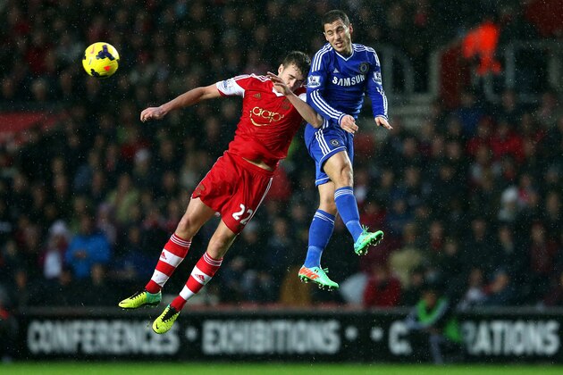 SOUTHAMPTON, ENGLAND - JANUARY 01:  Eden Hazard of Chelsea rises above Calum Chambers of Southampton to win a header during the Barclays Premier League match between Southampton and Chelsea at St Mary's Stadium on January 1, 2014 in Southampton, England.  (Photo by Warren Little/Getty Images)