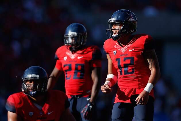 TUCSON, AZ - NOVEMBER 15:  Quarterback Anu Solomon #12 of the Arizona Wildcats prepares to snap the football during the college football game against the Washington Huskies at Arizona Stadium on November 15, 2014 in Tucson, Arizona. The Wildcats defeated the Huskies 27-26.  (Photo by Christian Petersen/Getty Images)