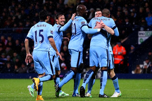 WEST BROMWICH, ENGLAND - DECEMBER 26:  Fernando of Manchester City celebrates with team-mates after scoring the opening goal during the Barclays Premier League match between West Bromwich Albion and Manchester City at The Hawthorns on December 26, 2014 in West Bromwich, England.  (Photo by Scott Heavey/Getty Images)