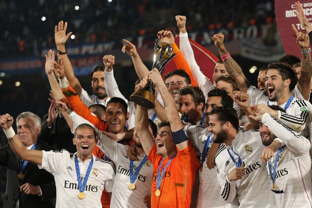 Real Madrid’s Iker Casillas, centre, lifts the trophy alongside team mates after winning the final soccer match between Real Madrid and San Lorenzo at the Club World Cup soccer tournament in Marrakech, Morocco, Saturday, Dec. 20, 2014. (AP Photo/Christophe Ena)