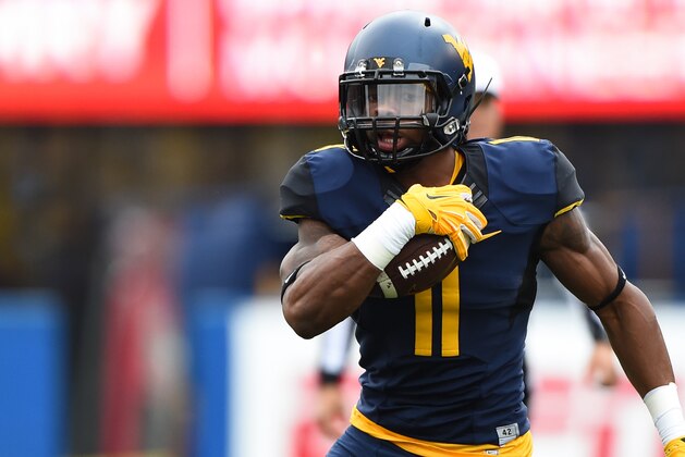 Nov 1, 2014; Morgantown, WV, USA; West Virginia Mountaineers wide receiver Kevin White (11) runs with ball after a catch during the first quarter against the TCU Horned Frogs at Milan Puskar Stadium. TCU Horned Frogs defeated West Virginia Mountaineers 31-30. Mandatory Credit: Tommy Gilligan-USA TODAY Sports