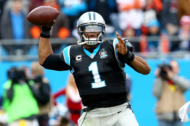 CHARLOTTE, NC - DECEMBER 21:   Cam Newton #1 of the Carolina Panthers drops back to pass against the Cleveland Browns during their game at Bank of America Stadium on December 21, 2014 in Charlotte, North Carolina.  (Photo by Streeter Lecka/Getty Images)
