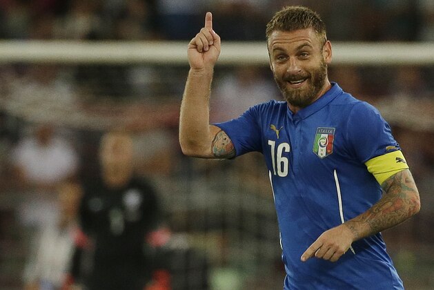 Italy's Daniele De Rossi celebrates after scoring during a friendly soccer match between Italy and The Netherlands in Bari, Italy, Thursday, Sept. 4, 2014. (AP Photo/Gregorio Borgia)
