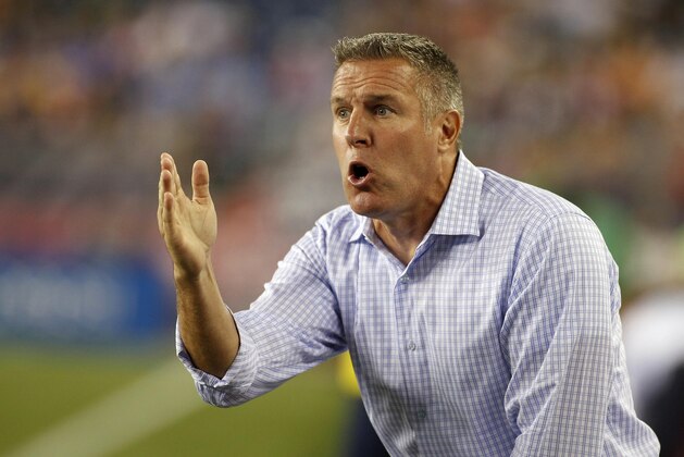 Sep 3, 2014; Foxborough, MA, USA; Sporting KC head coach Peter Vermes yells instructions to his team during the first half against the New England Revolution at Gillette Stadium. The New England Revolution defeated Sporting KC 3-1. Mandatory Credit: Stew Milne-USA TODAY Sports