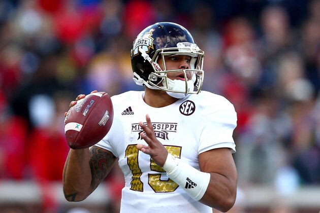 OXFORD, MS - NOVEMBER 29:  Dak Prescott #15 of the Mississippi State Bulldogs looks to pass against the Mississippi Rebels during their game at Vaught-Hemingway Stadium on November 29, 2014 in Oxford, Mississippi.  (Photo by Streeter Lecka/Getty Images)