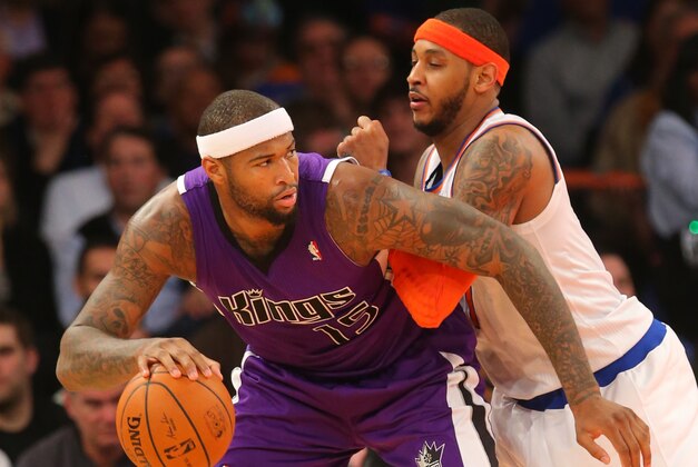Feb 12, 2014; New York, NY, USA;  Sacramento Kings center DeMarcus Cousins (15) works against New York Knicks small forward Carmelo Anthony (7) during the second half at Madison Square Garden. Sacramento Kings defeat the New York Knicks 106-101 in OT. Mandatory Credit: Jim O'Connor-USA TODAY Sports
